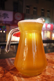 pitcher of unpasteurized Tsingtao beer