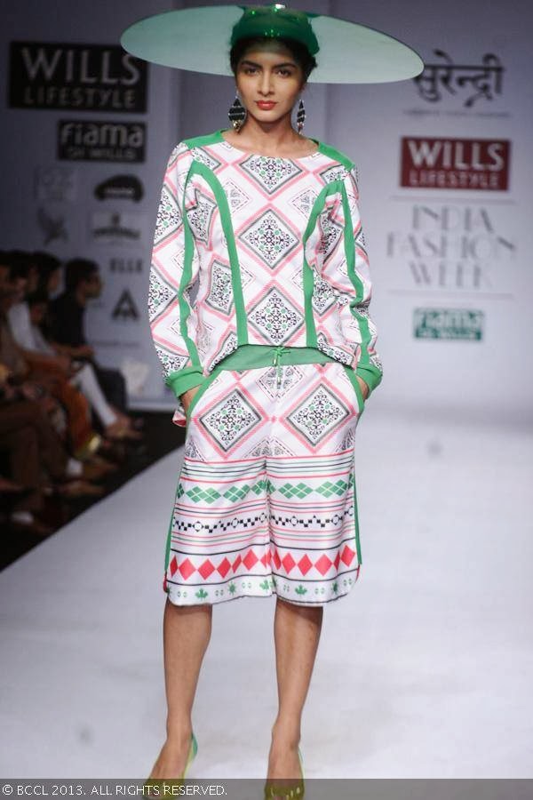 A model showcases a creation by fashion designer Yogesh Chaudhary on Day 4 of Wills Lifestyle India Fashion Week (WIFW) Spring/Summer 2014, held in Delhi.