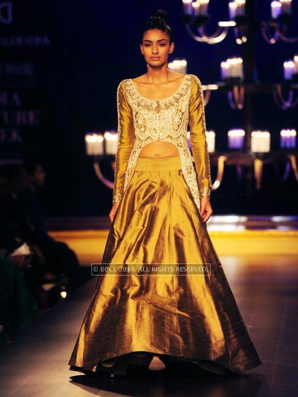 A model walks the ramp for designer Manish Malhotra on Day 4 of India Couture Week, 2014, held at Taj Palace hotel, New Delhi.