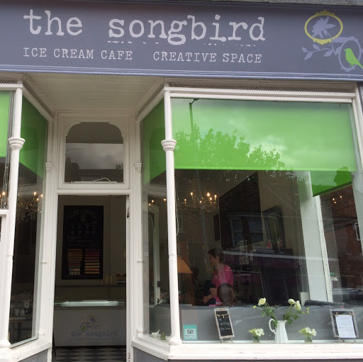 The Songbird Ice Cream Cafe and Creative Space logo