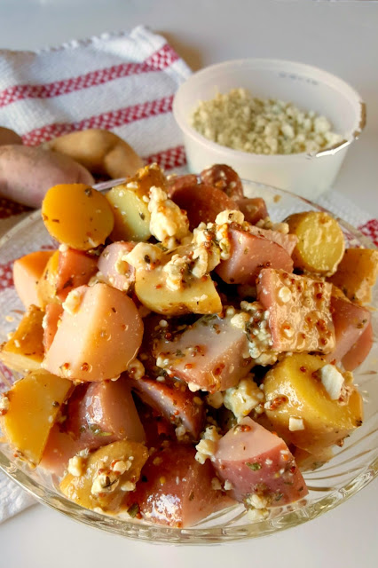 This Red White and Blue Cheese Potato Salad is a French style spin on a summer picnic favorite that your guests will love!
