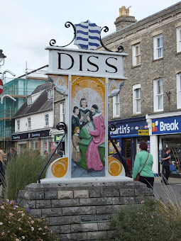 Diss town sign - which depicts John Skelton, the rector of St. Mary's Church from 1504 until his death teaching Henry VIII