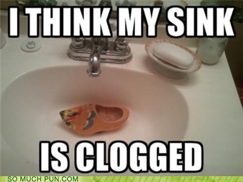 Photo of a sink with a clog (shoe) in it: I think my sink is clogged