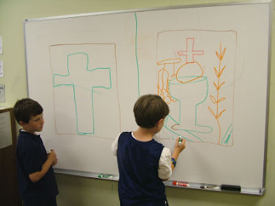 Children designing their first communion banners