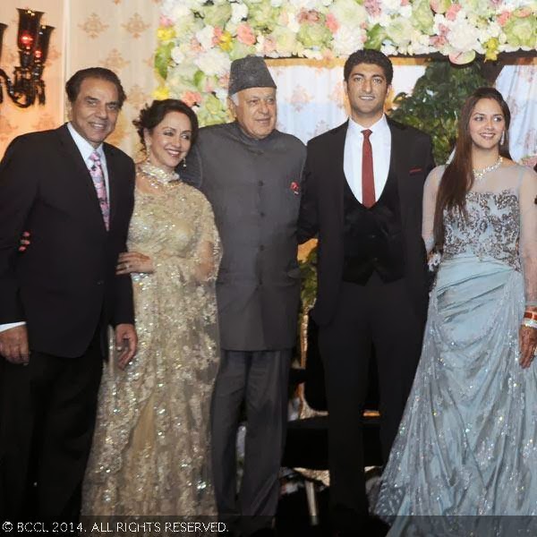 National Conference leader Dr Farooq Abdullah  poses with Ahana Deol and Vaibhav Vora during the wedding reception party, held at Vohra Farmhouse, New Delhi.