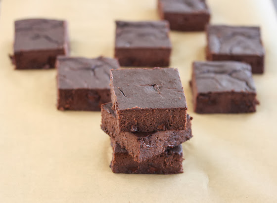 photo of a stack of brownies with more brownies in the background