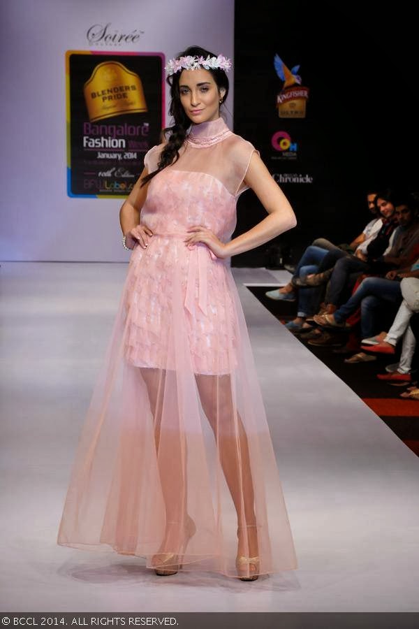 A model walks the ramp in a creation by designers Disha and Menaka during Blenders Pride Bangalore Fashion Week.<br /> 