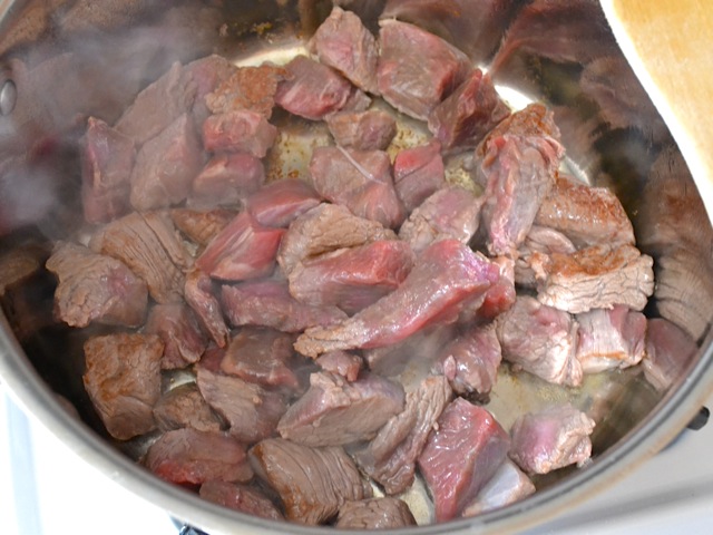 sear beef chunks in pan 