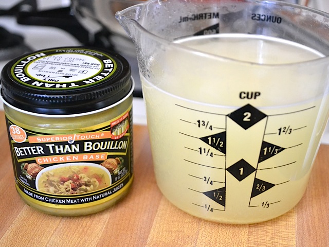 chicken broth in measuring cup 