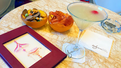 Enjoying a Wynn Signature Sip of The Pear-a-sol, Parasol's signature cocktail at Parasol Down. The cocktail includes Absolut Pears Vodka, Belle Paire Pear Liqeur, pear puree, and fresh sweet and sour along with complimentary snacks