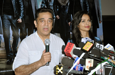 Kamal Haasan with co-star Pooja Kumar addressing the media on the controversy surrounding the movie 'Vishwaroop', held in Mumbai on January 31, 2013. (Pic: Viral Bhayani)