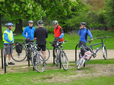 Five cyclists collecting bikes