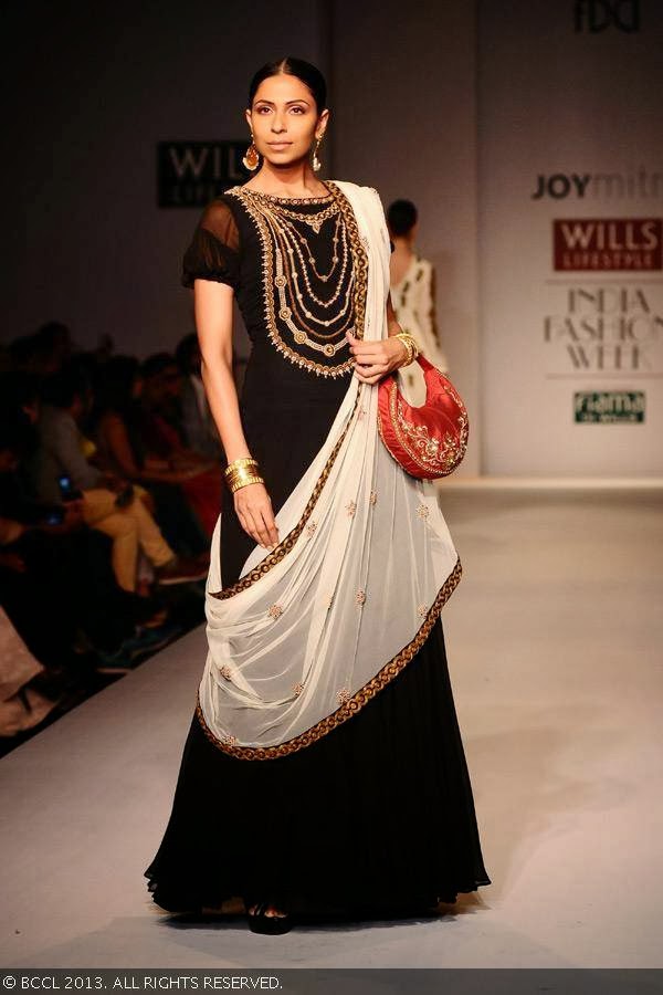 Candice Pinto showcases a creation by fashion designer Joy Mitra on Day 5 of Wills Lifestyle India Fashion Week (WIFW) Spring/Summer 2014, held in Delhi.