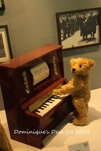Teddy bear playing the piano