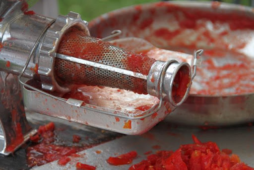 Tomatoes by Hand Mill 2 The "eject hole" for skins and seeds.