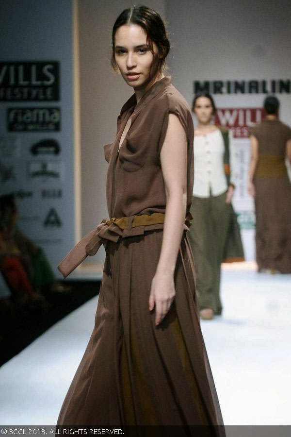 A model walks the ramp for fashion designer Mrinalini on Day 3 of the Wills Lifestyle India Fashion Week (WIFW) Spring/Summer 2014, held in Delhi.