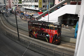 Tram in Hong Kong with UniQ Grand condos advertising