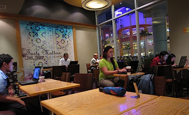 people with laptops inside Coffee Bean & Tea Leaf