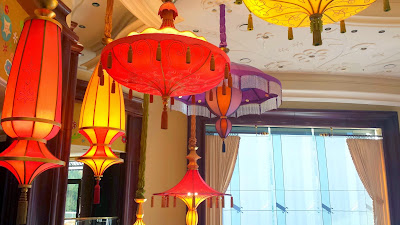 These umbrella lights move up and down in the atrium which houses the Parasol Down bar and lounge (Parasol Up is on the same level before you go down the curved escalator) at The Wynn, Las Vegas
