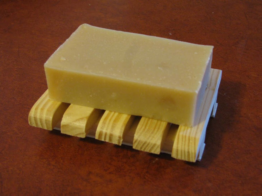 A Rectangle Bar of our Goat's Milk Soap on a Wooden Soap Dish