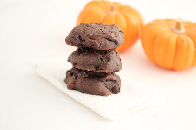 photo of a stack of three chocolate pumpkin cookies