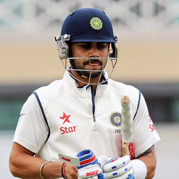 India's Virat Kohli walks back to the pavilion after getting out LBW for 8 runs by England's Stuart Broad during day five of the first Test between England and India at Trent Bridge cricket ground, Nottingham, England, Sunday, July 13, 2014. 