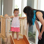 At the LePort Schools Parent & Child Montessori Infant program, moms encourage safety in activity with words.  Here, this mom asks her daughter to sit down before sliding down, motivating her child to follow directions, enhance listening skills which supports her independence in decision making.