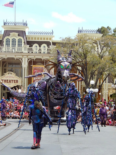 New Disney World Parade: Festival of Fantasy. Maleficent rolls in, guided by her henchman.