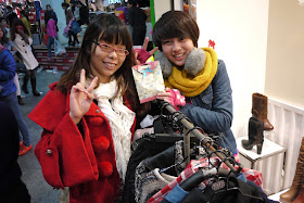 two young woman and a Christmas Eve apple gift in Quanzhou, China