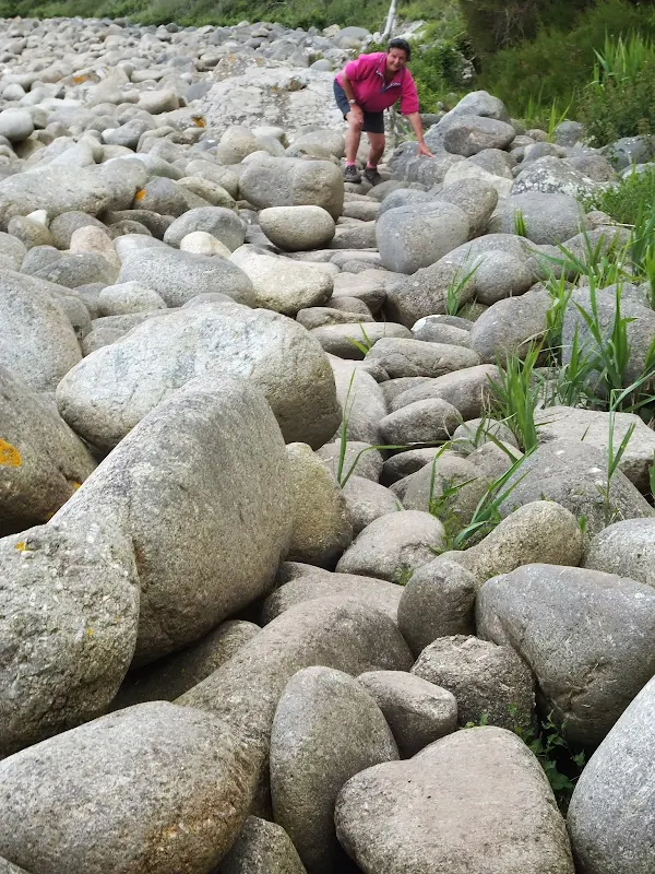 NAviagting across the large pebbles at St Loy's Cove