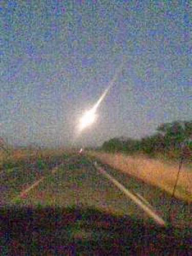 Bright Orb Ufo Travels Ahead Of Moving Vehicle