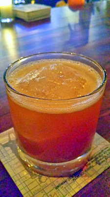 Laurelhurst Market cocktail of Smoke Signals, with Tennessee Whiskey, Sherry, Pecan, Lemon, and Smoked Ice