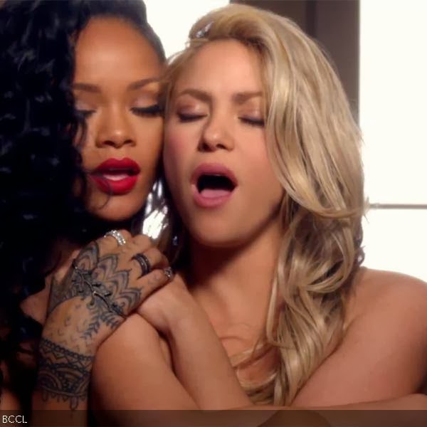 Rihanna and Shakira share a naked embrace in their raunchy new video for the single 'Can't Remember To Forget You'.