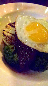 Zeus Cafe dinner entree of bulgogi braised short ribs, grilled rice cake, spicy broccoli, sunny side egg