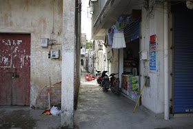 alley with motorbikes in Hetoupu, Zhuhai, China