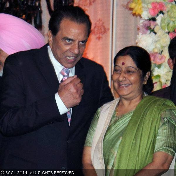 Dharmendra and Sushma Swaraj clicked on stage during Ahana Deol and Vaibhav Vora's wedding reception party, held at Vohra Farmhouse, New Delhi.