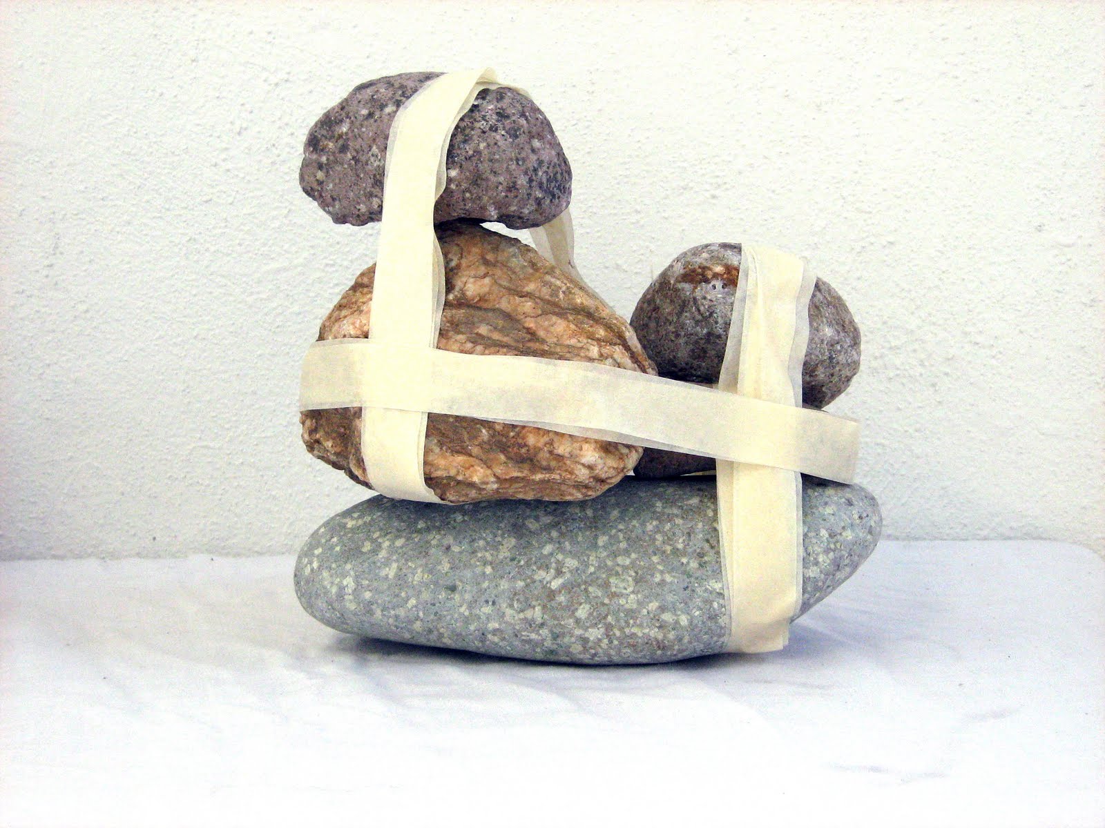 Stones tied with masking tape (VI)