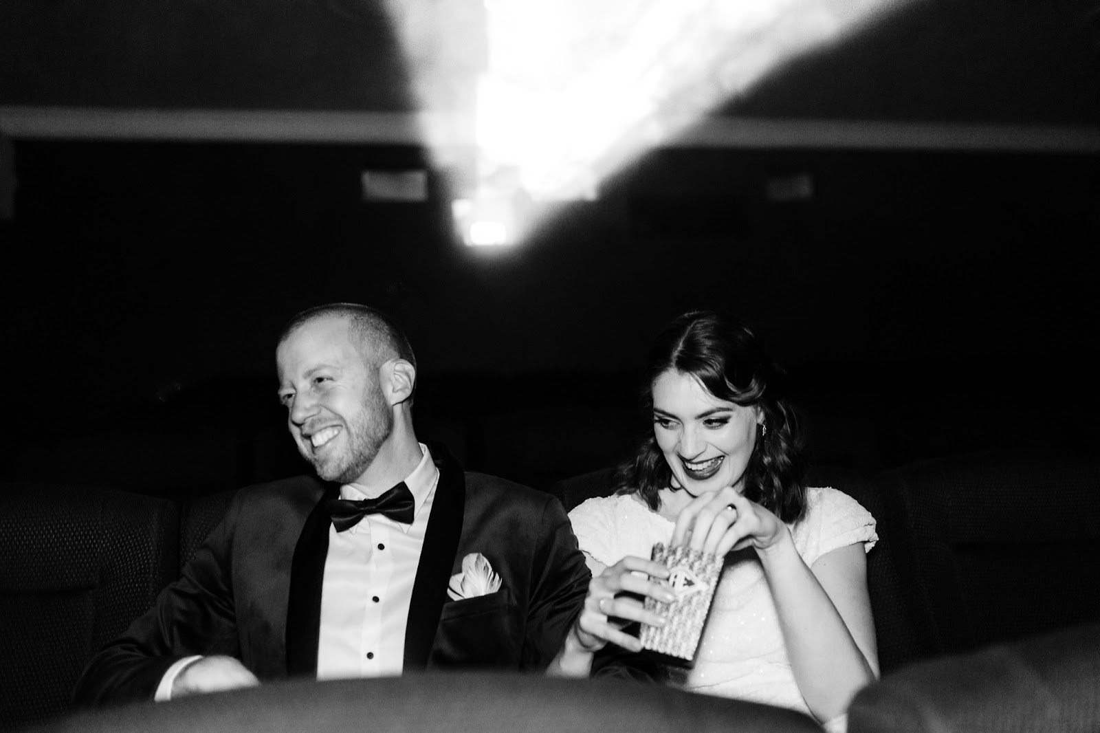 Bride and groom portraits in The Regal cinema Adelaide candid style of wedding photography
