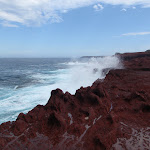 Waves crashing onto red cliffs (105400)