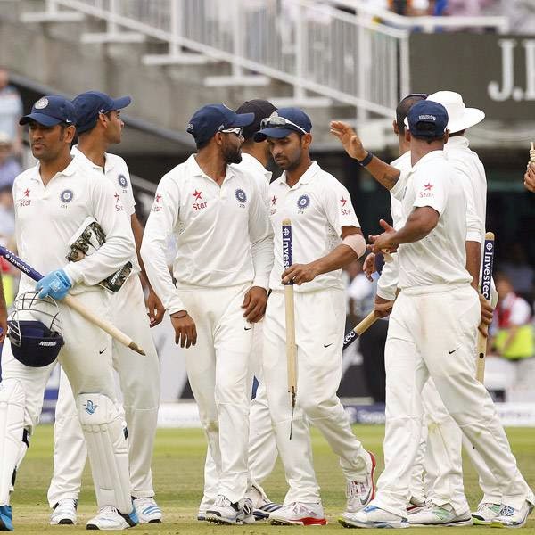 The Indian team celebrate after winning the match by 95 runs on the fifth day of the second cricket Test match between England and India at Lord's cricket ground in London, on July 21, 2014. 