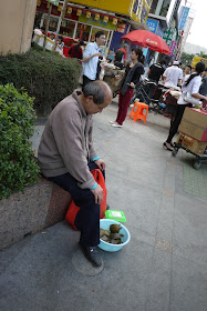 man selling turtles in Zhuhai, Guangdong