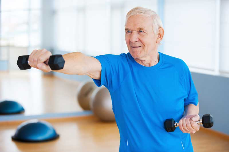aged adult lifting free weights