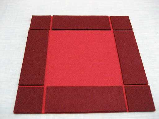 Align the rectangles along the edges, and center between the squares, sticky side down. Press in place. Align the rectangles along the edges, and center between the squares, sticky side down. Press in place.