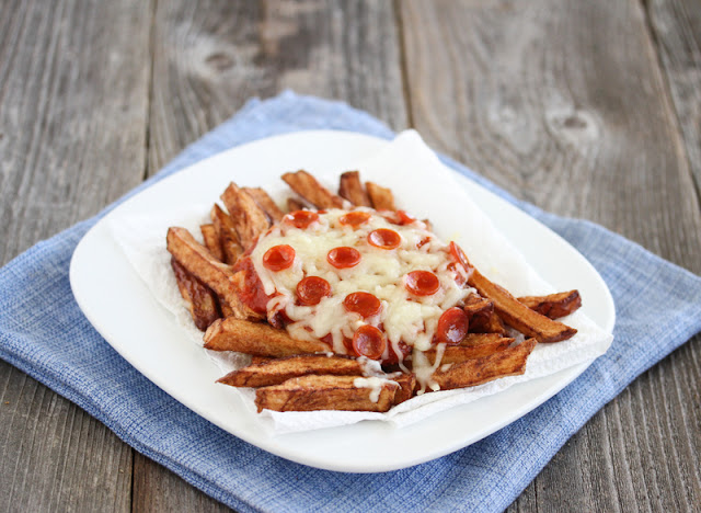 photo of pizza fries on a plate
