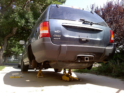 Supported by jack stands, and with a jack under the rear axle