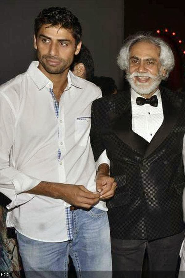Cricketer Ashish Nehra and Sunil Sethi attend the Wills Lifestyle India Fashion Week (WIFW) Spring/Summer 2014, held in Delhi. (Pic: Viral Bhayani)