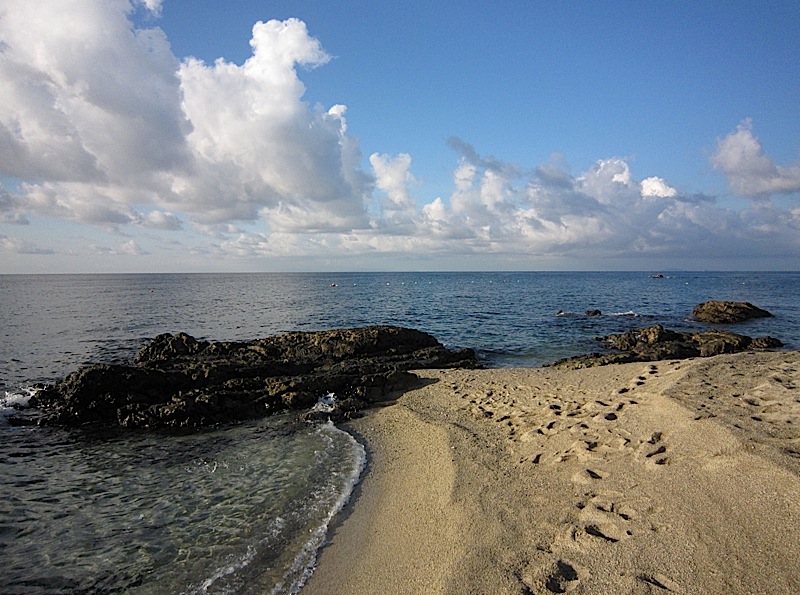 rocks on the shoreline of La Luz Beach Resort in San Juan, Batangas