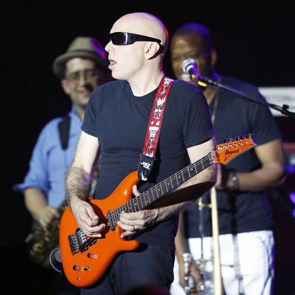 US rock guitarist Joe Satriani performs on stage during the Monte Carlo Summer Festival on July 23, 2014 in Monaco.