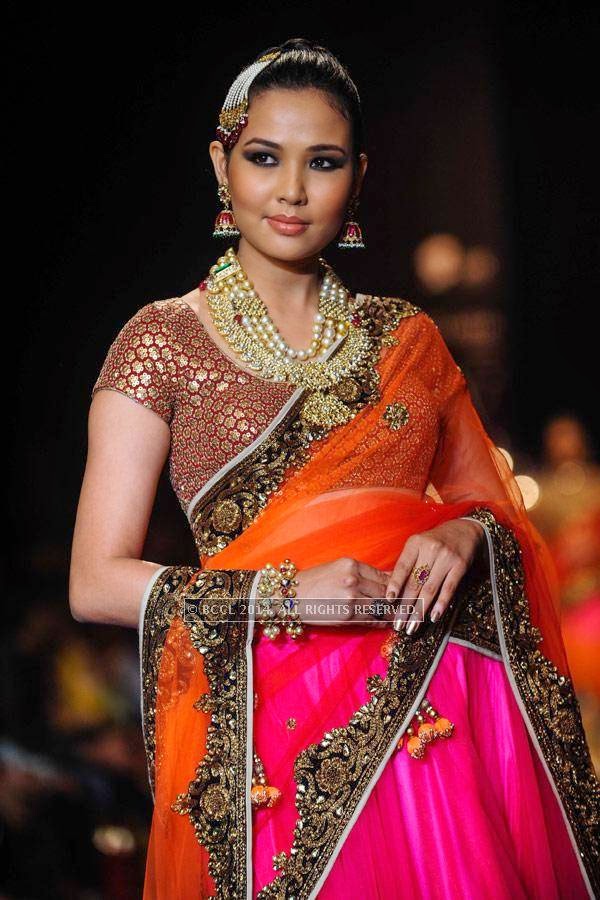 A model displays a creation by Golecha Jewels on Day 3 of India International Jewellery Week (IIJW), 2014, held at Grand Hyatt, in Mumbai.<br /> <br /> <br /> <br /> <br /> <br /> 