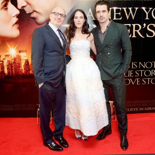 From left, US director Akiva Goldsman, English actress Jessica Brown Findlay and Irish actor Colin Farrell pose for photographers on the red carpet for A New York Winter's Tale UK Premiere on Thursday Feb. 13, 2014, in London.